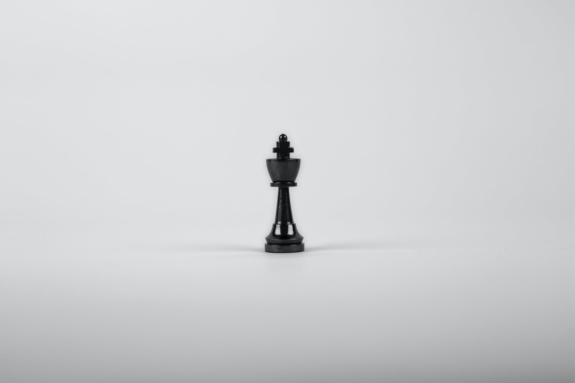 black wooden king chess piece